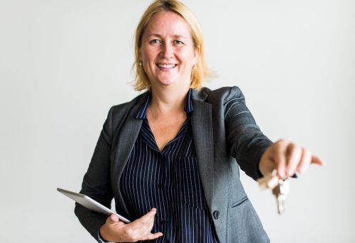 Real Estate Agent Handing Over The Keys